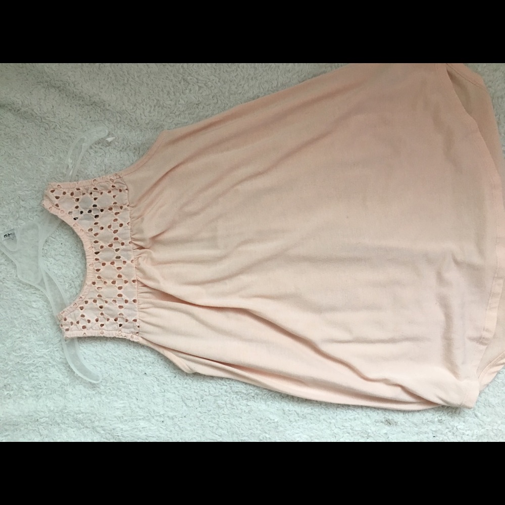 peach flowy tank top with lace trim at the top